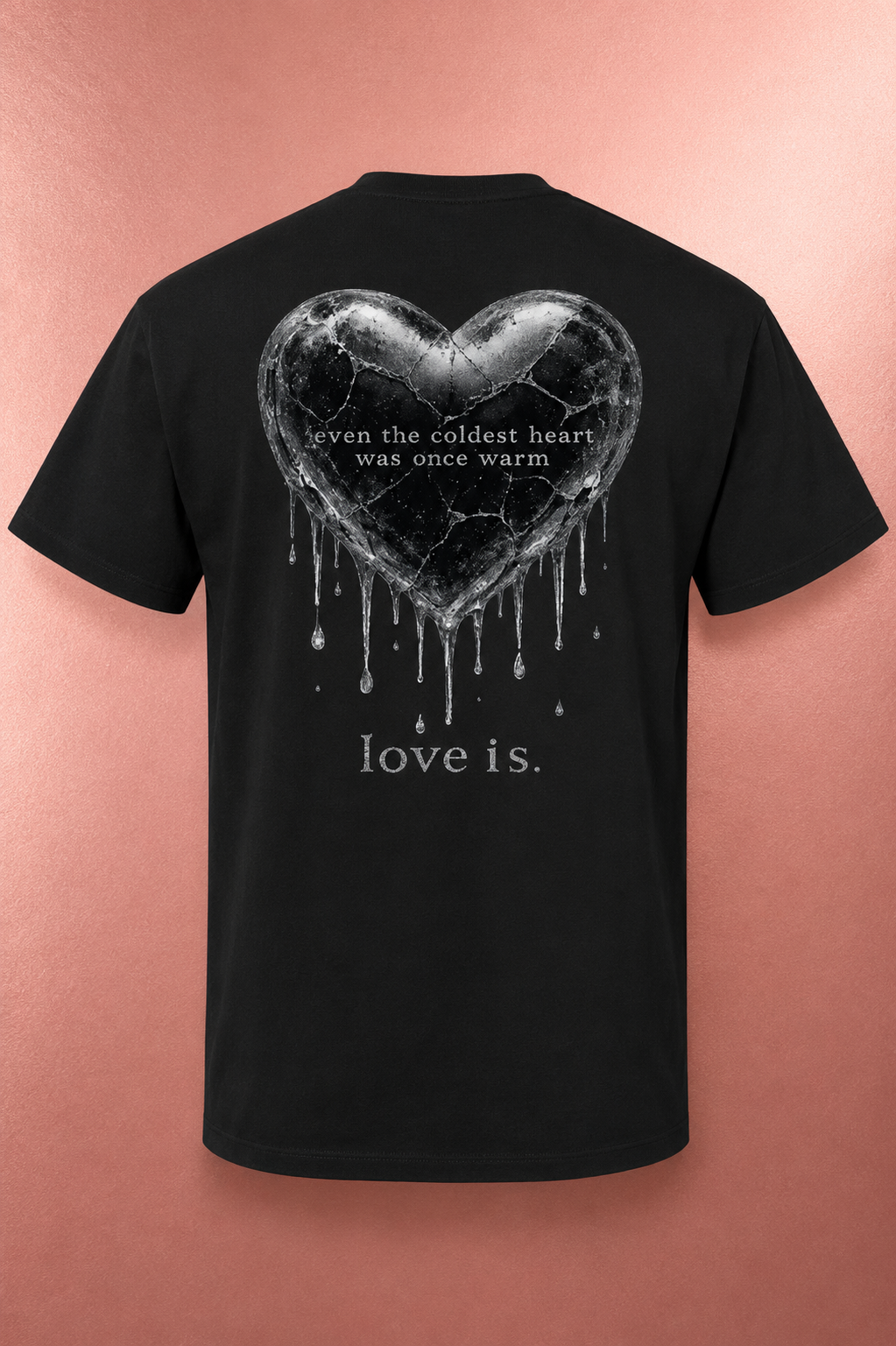 Black oversized healing graphic tee with the "Even the Coldest Heart Was Once Warm" cracked heart design on the back