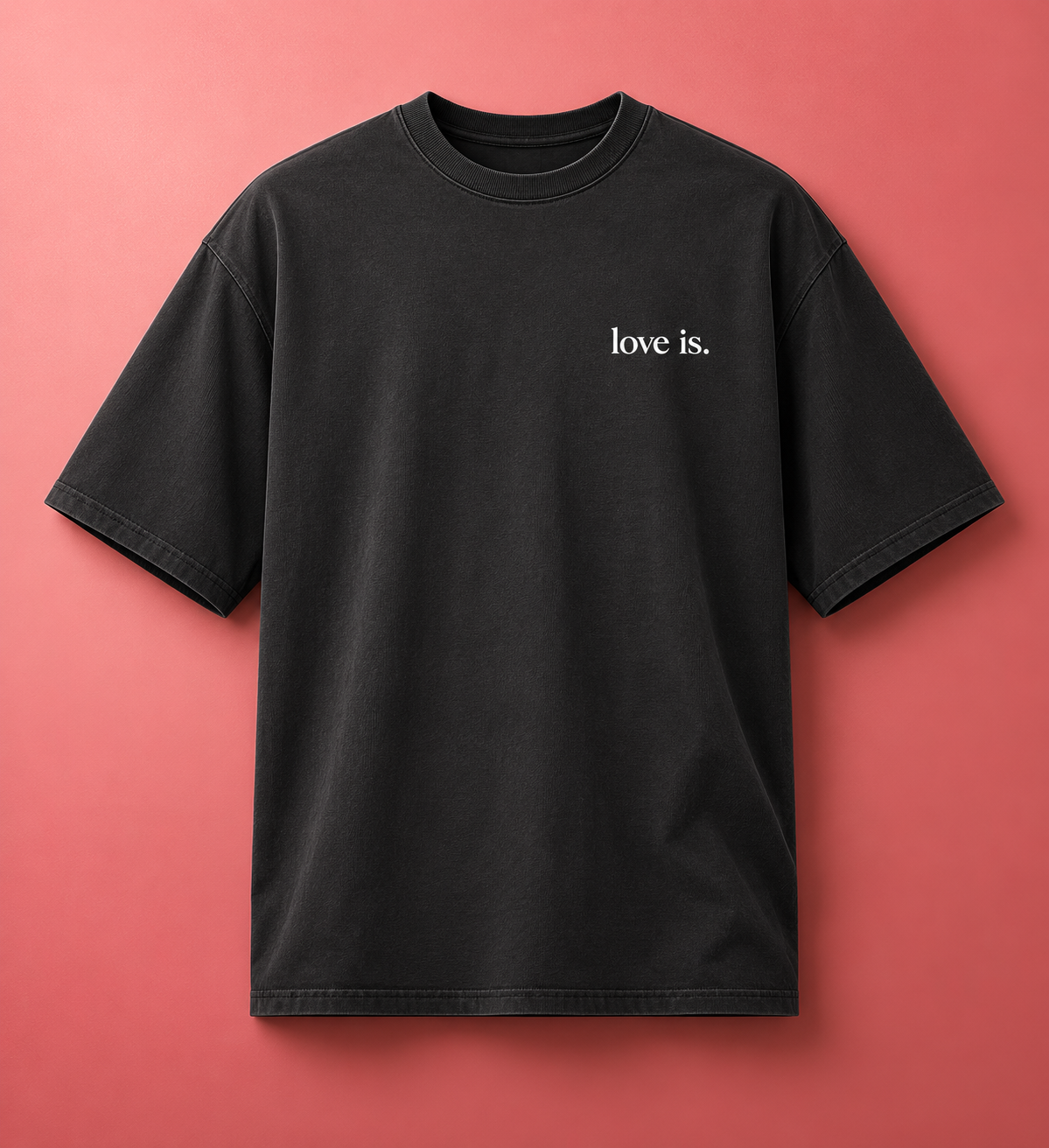 Black oversized faded t-shirt featuring the love is. design with the words patient, kind, understanding, gentle, and real on the back. Inspirational Christian streetwear apparel promoting faith, love, and biblical values.